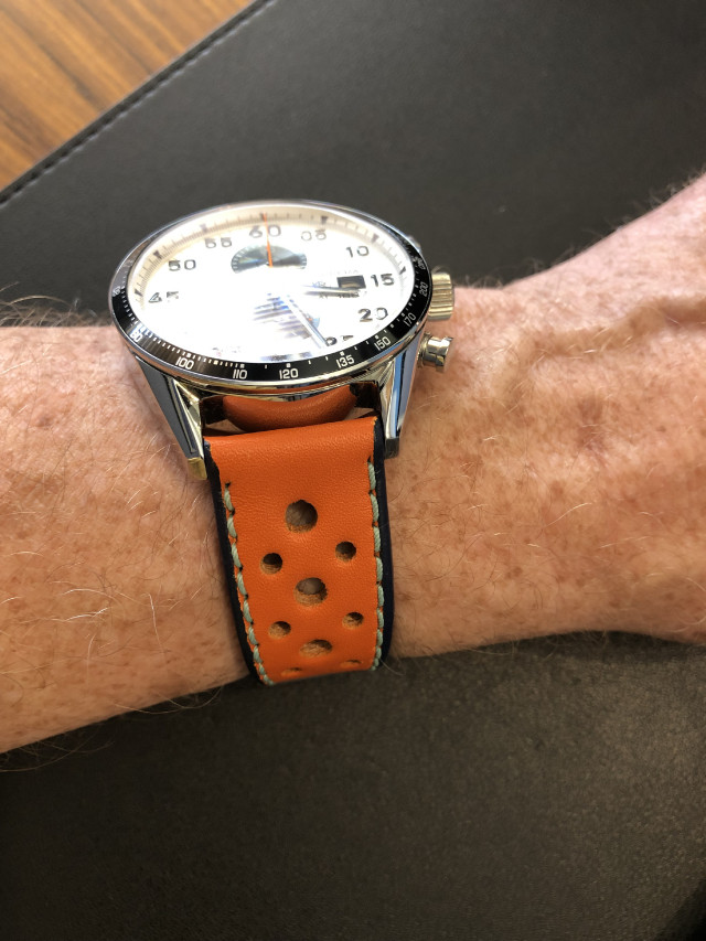 TAG Carrera with orange on wrist